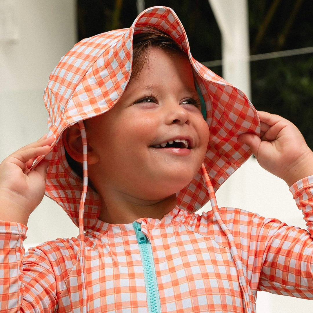Chapéus de praia infantis combinando com looks de praia 
