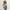 Modelo vestindo biquininho Liz com saídinha de praia Pareô infantil da Lili Sampedro, em estampa exclusiva Vichy Laranja