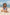 Menina na praia sentada com biquíni infantil na estampa Vichy e chapéuzinho de praia com protecao UV na mesma estampa combinando da Lili Sampedro